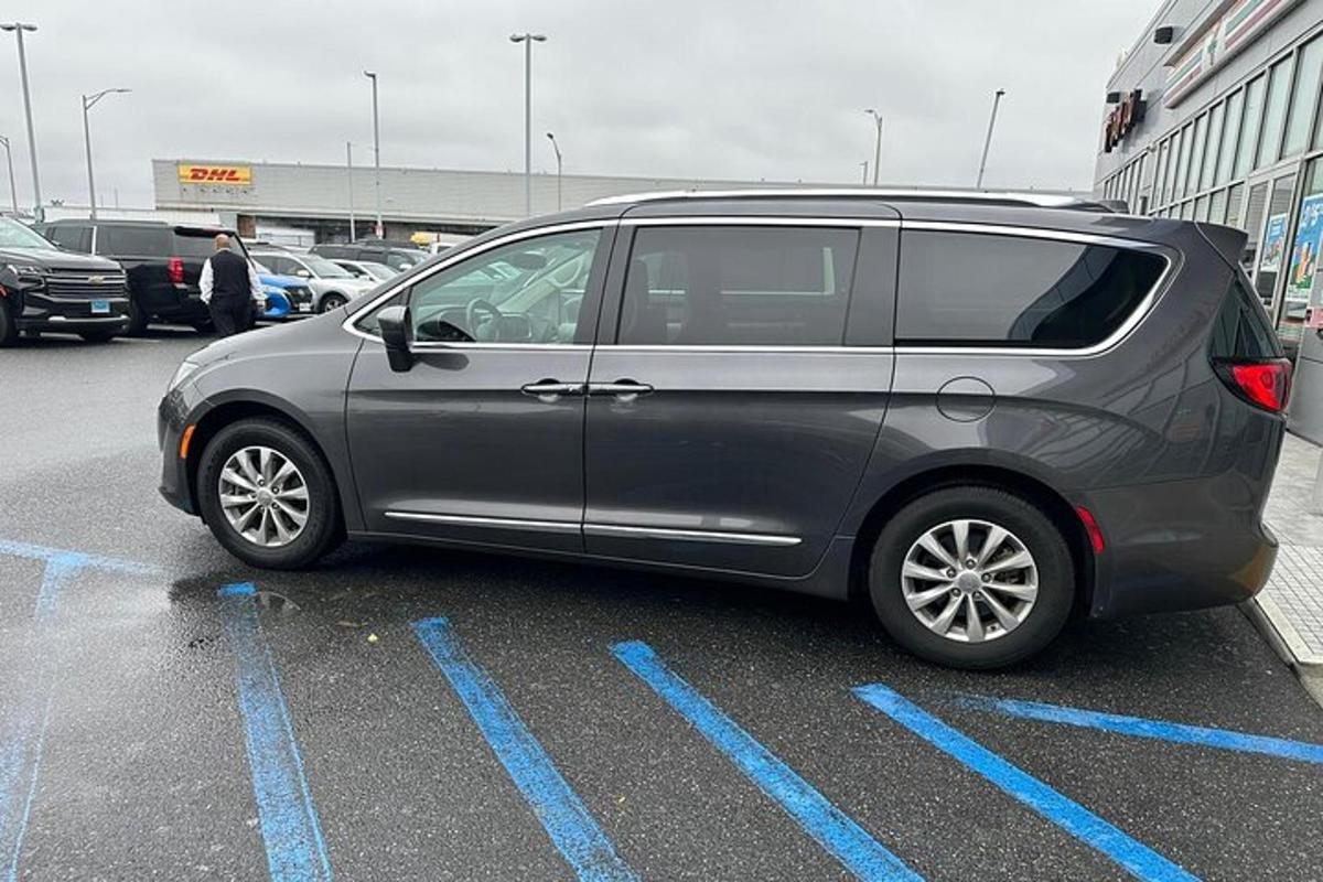 a silver van parked in a parking lot