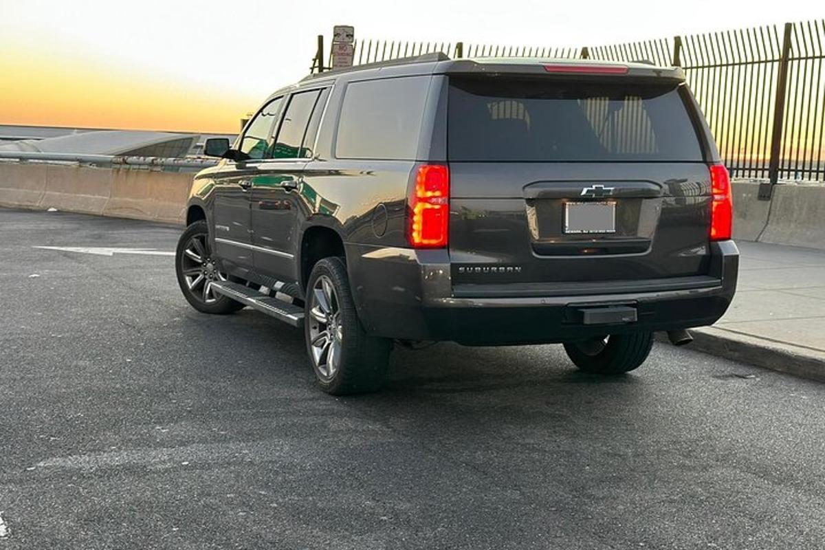 a black suv parked in a parking lot