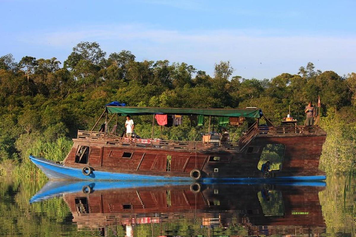 a boat in the water with a person on it