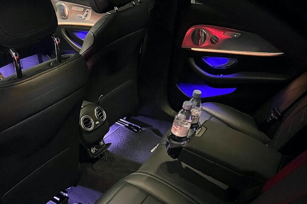 a view of the back seat of a car with two water bottles
