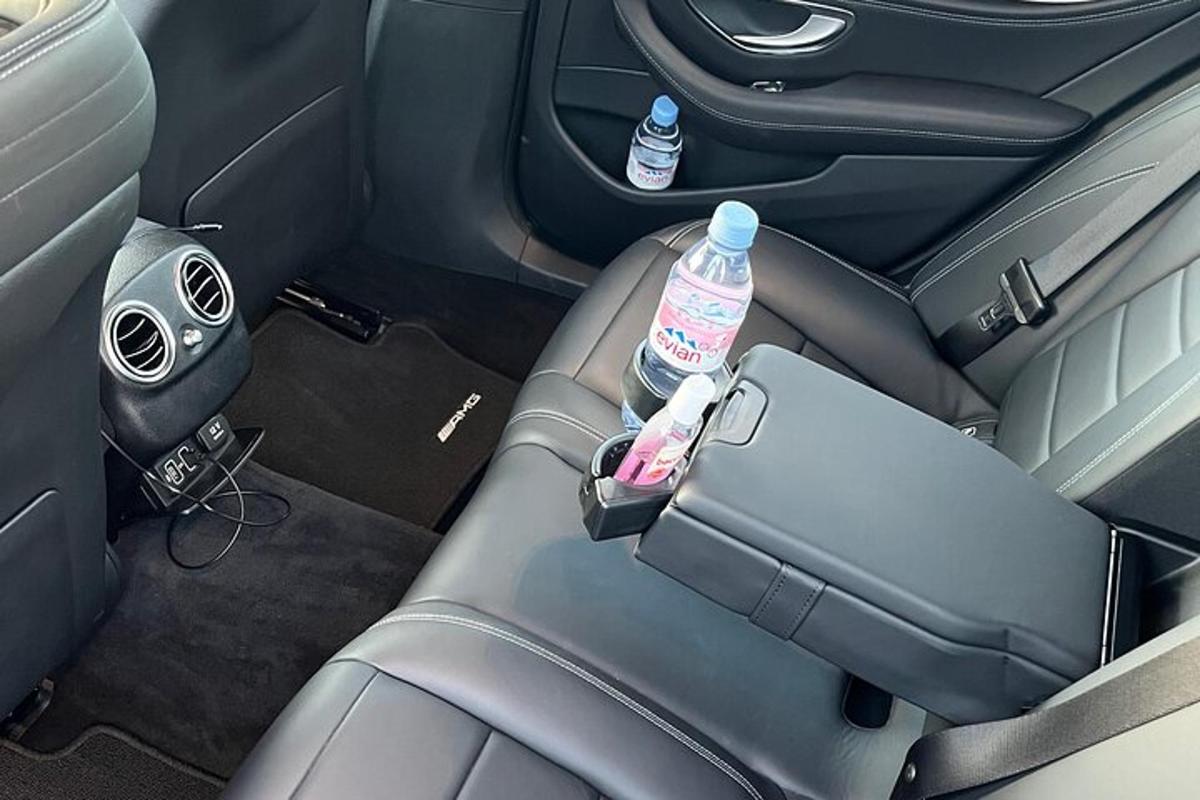 two water bottles sitting on the seat of a car