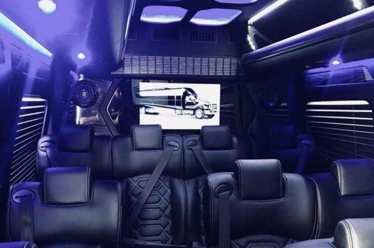 a view of the inside of a bus with a laptop