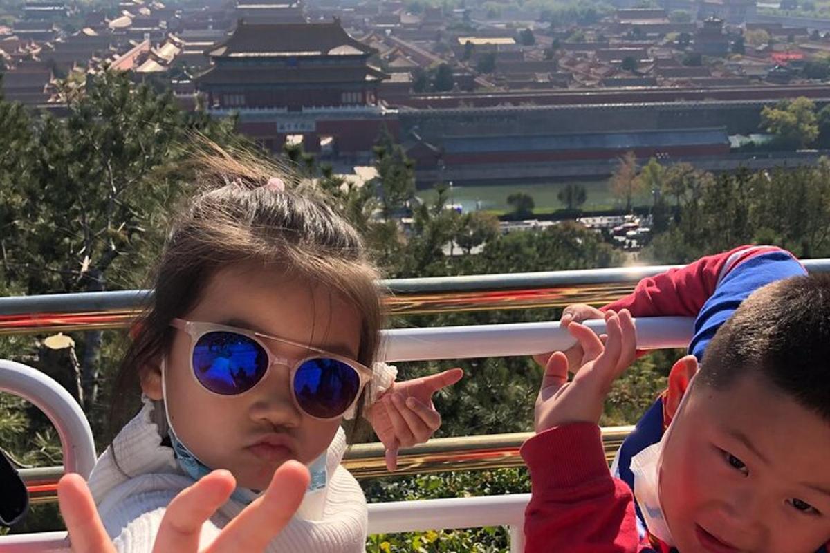a little girl wearing sunglasses and a boy