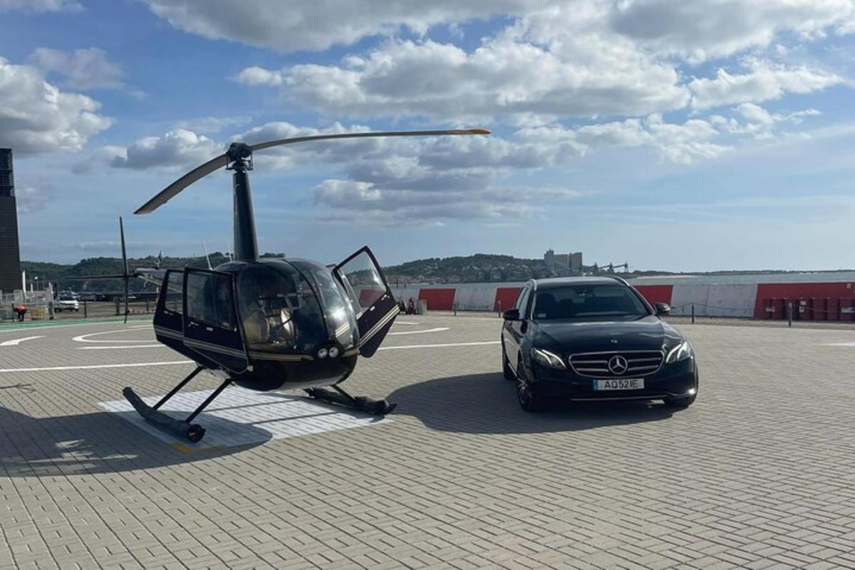 a helicopter and a car parked in a parking lot