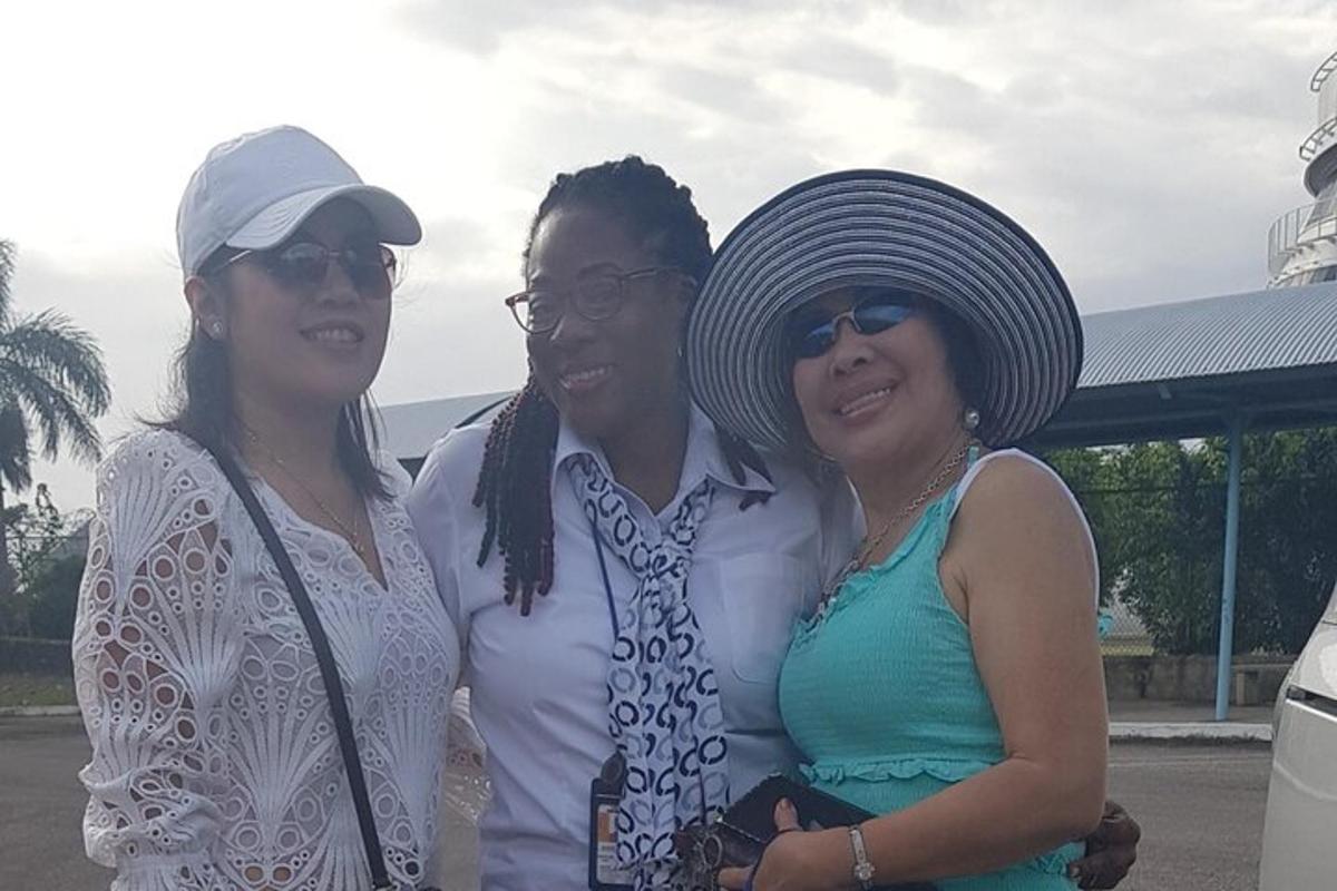 two women and a man posing for a picture