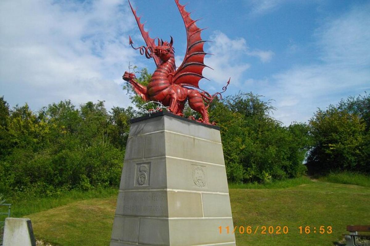 a statue of a dragon on top of a monument
