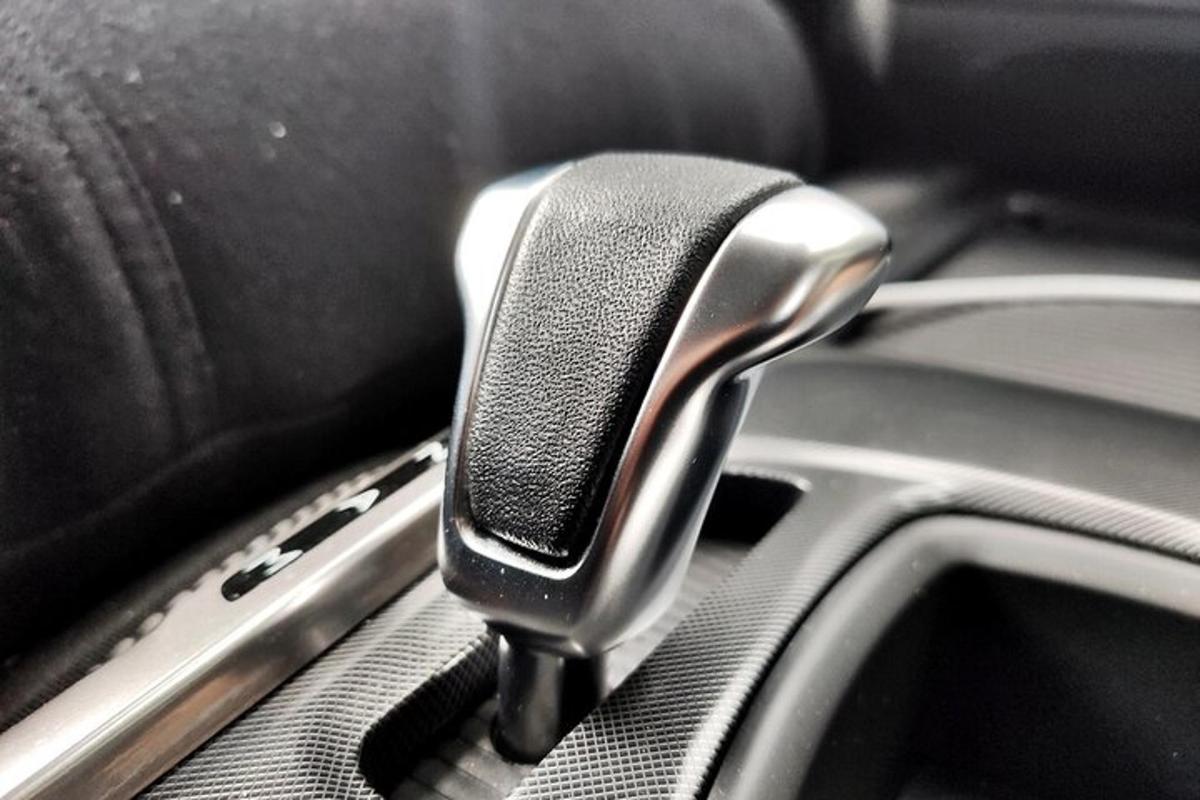 a close up of a car seat with a carabiner
