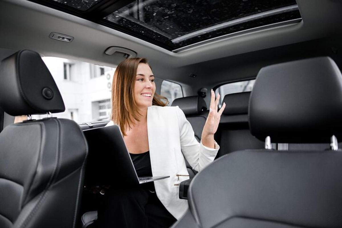 a woman sitting in the back seat of a car