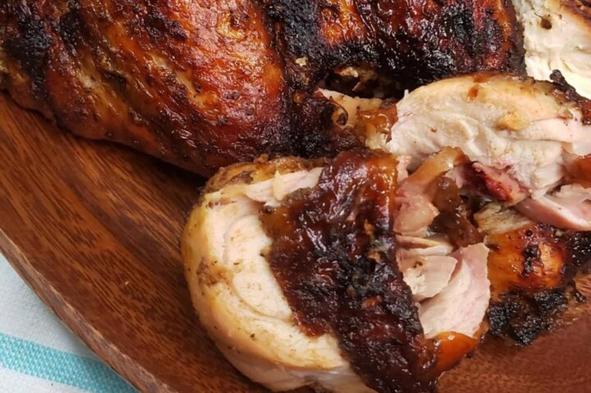 a close up of a piece of meat on a cutting board