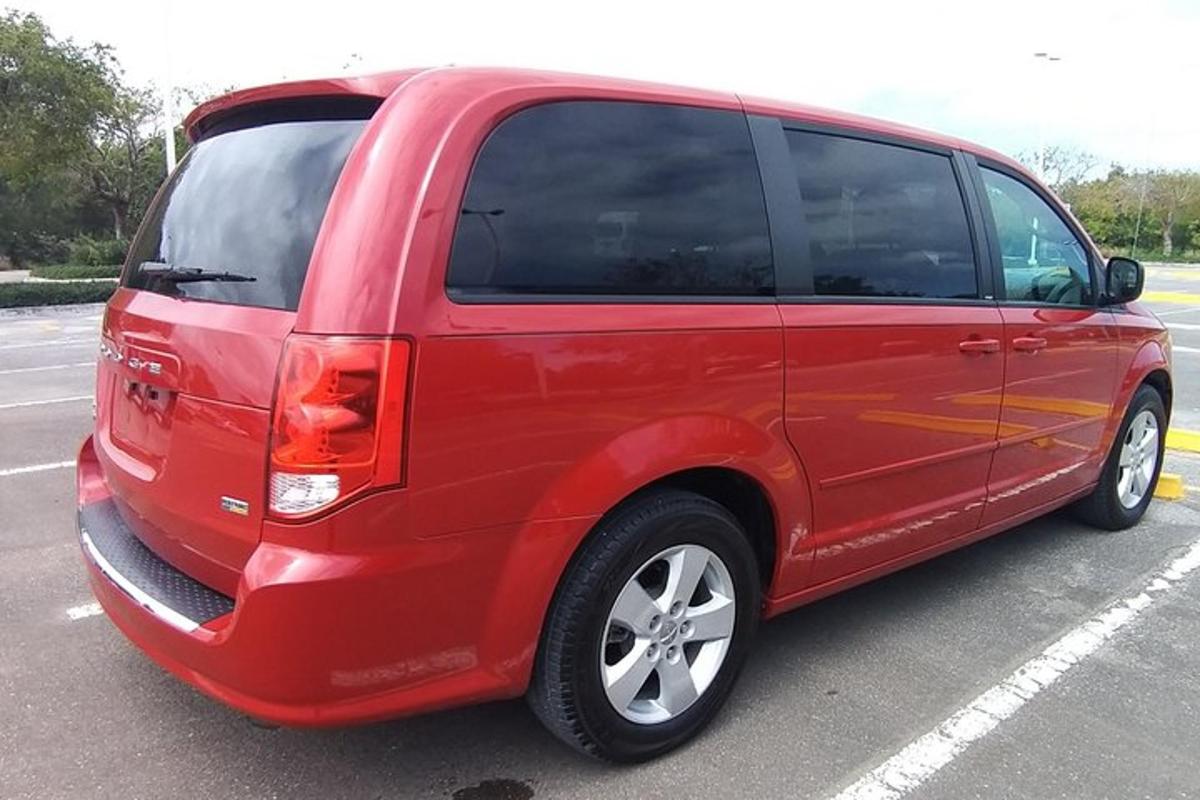 a red van parked in a parking lot
