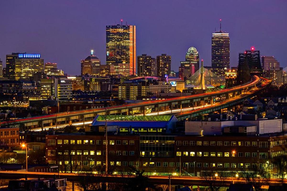 a view of a city at night with a freeway