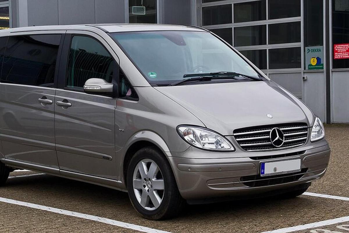 a silver van parked in a parking lot