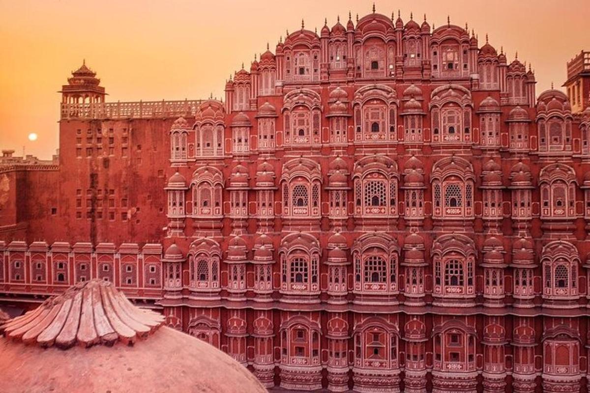 a large pink palace with a large building