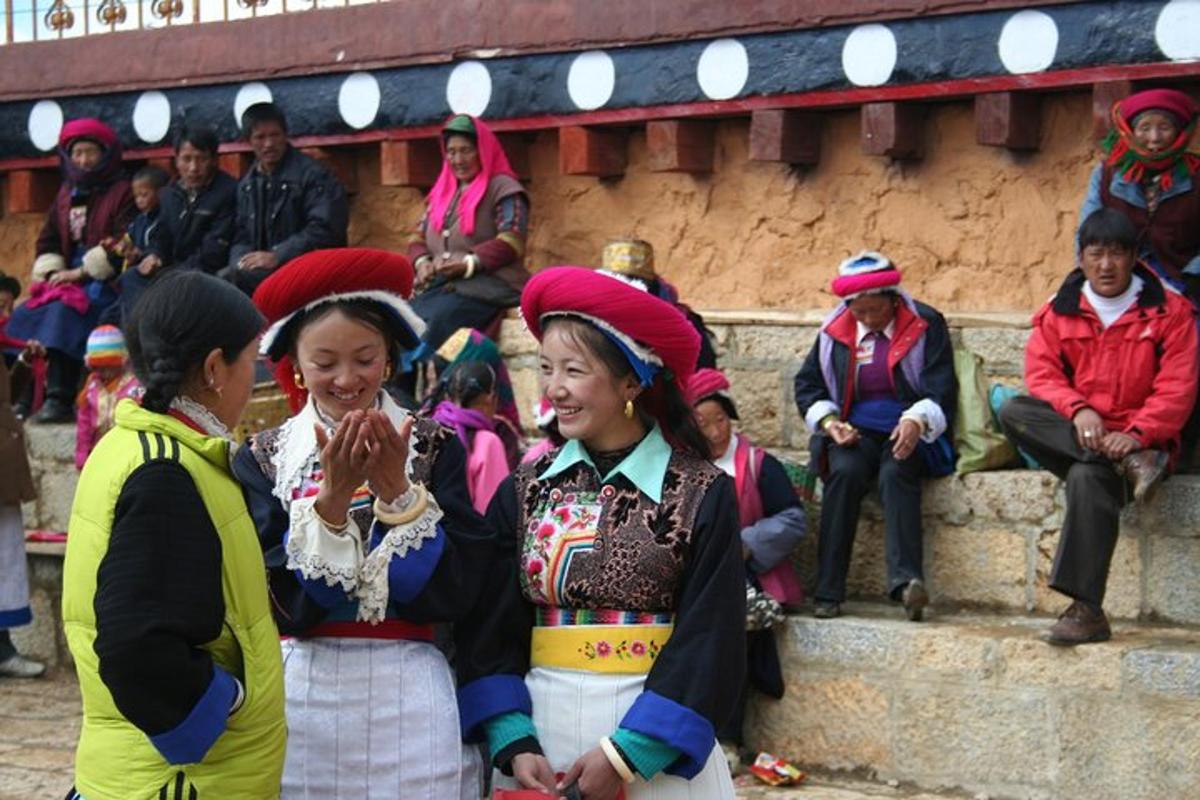 a group of people sitting on steps in front of a crowd