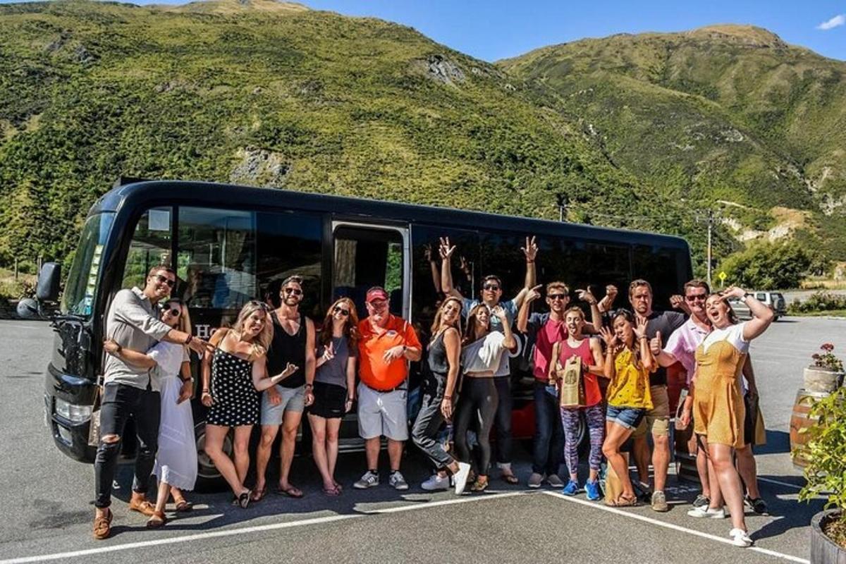 a group of people standing in front of a bus