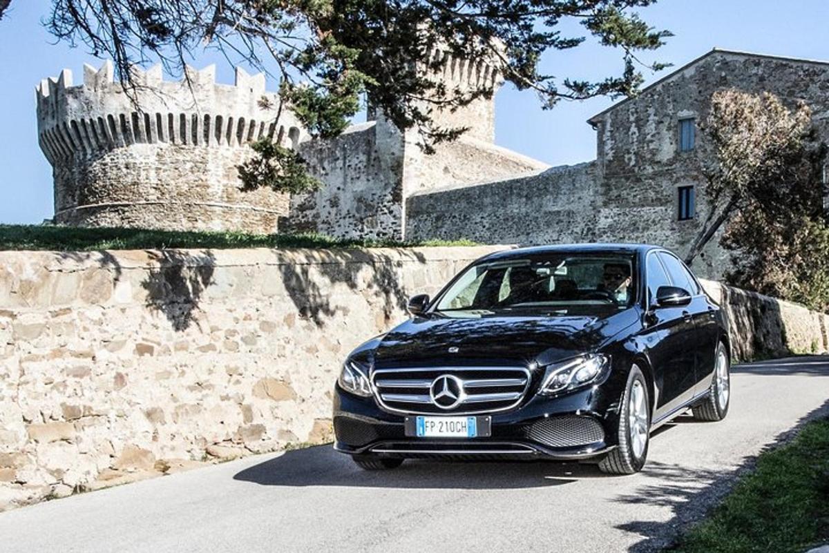 a mercedes benz car parked in front of a castle