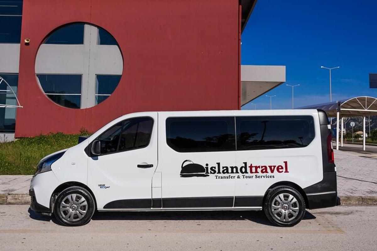 a white van parked in front of a building