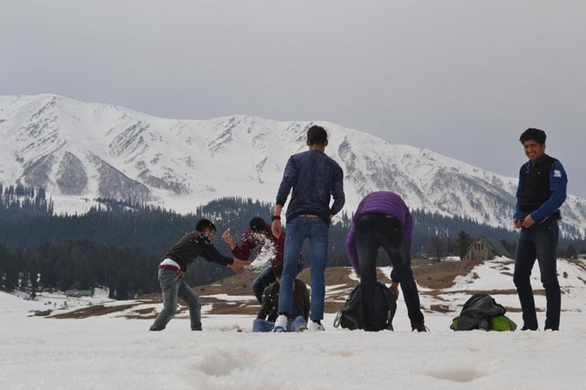 a group of people standing in the snow