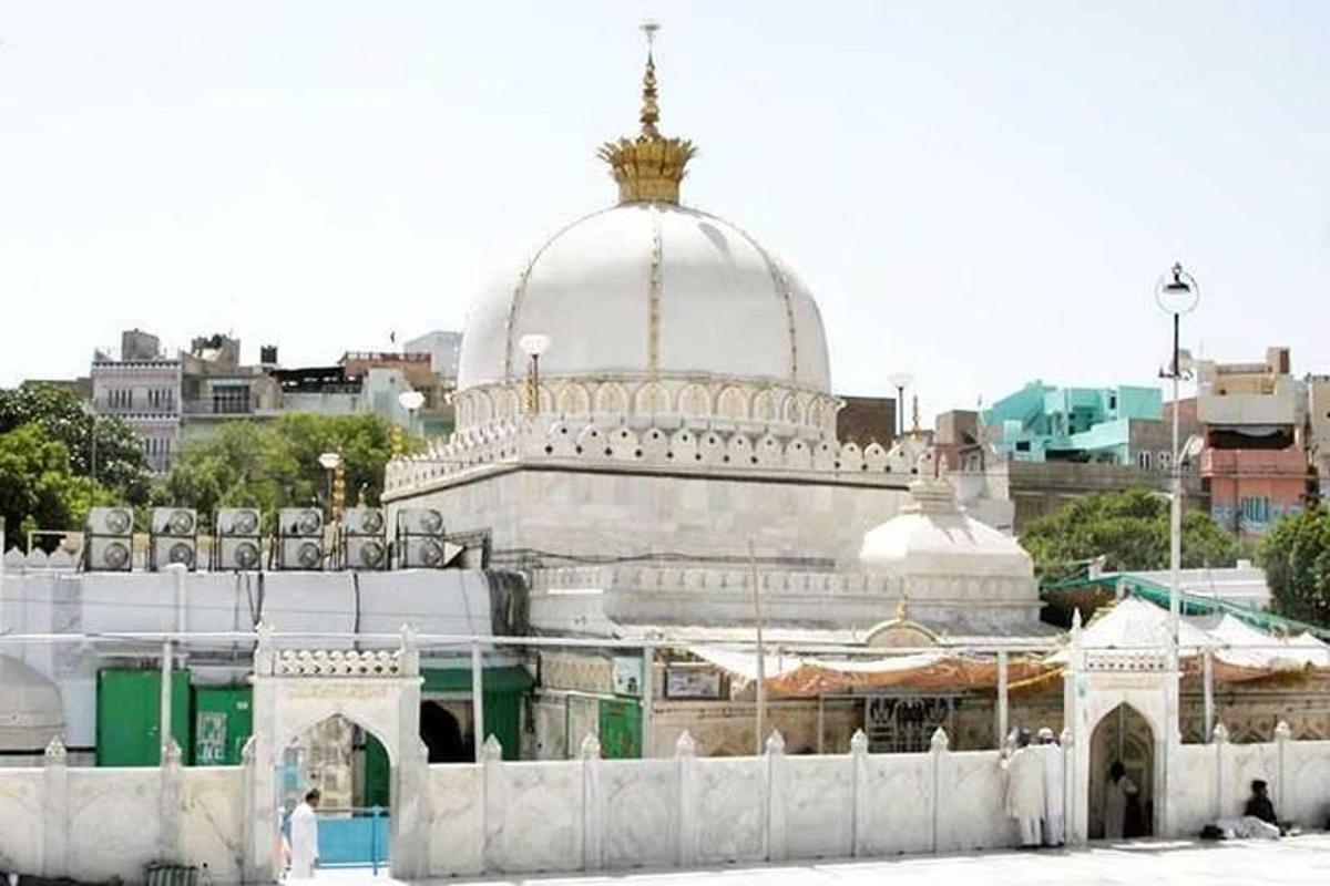 a large white building with a dome on top of it