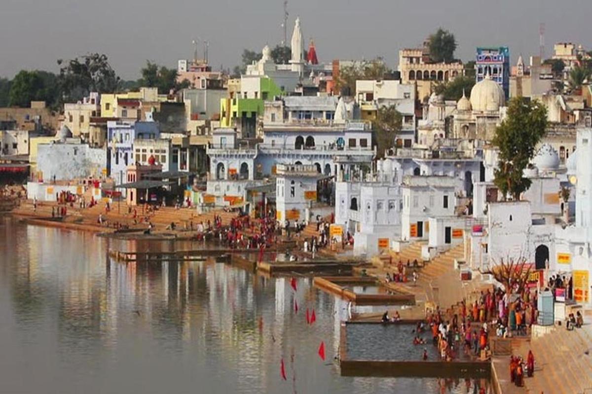 a group of buildings next to a body of water