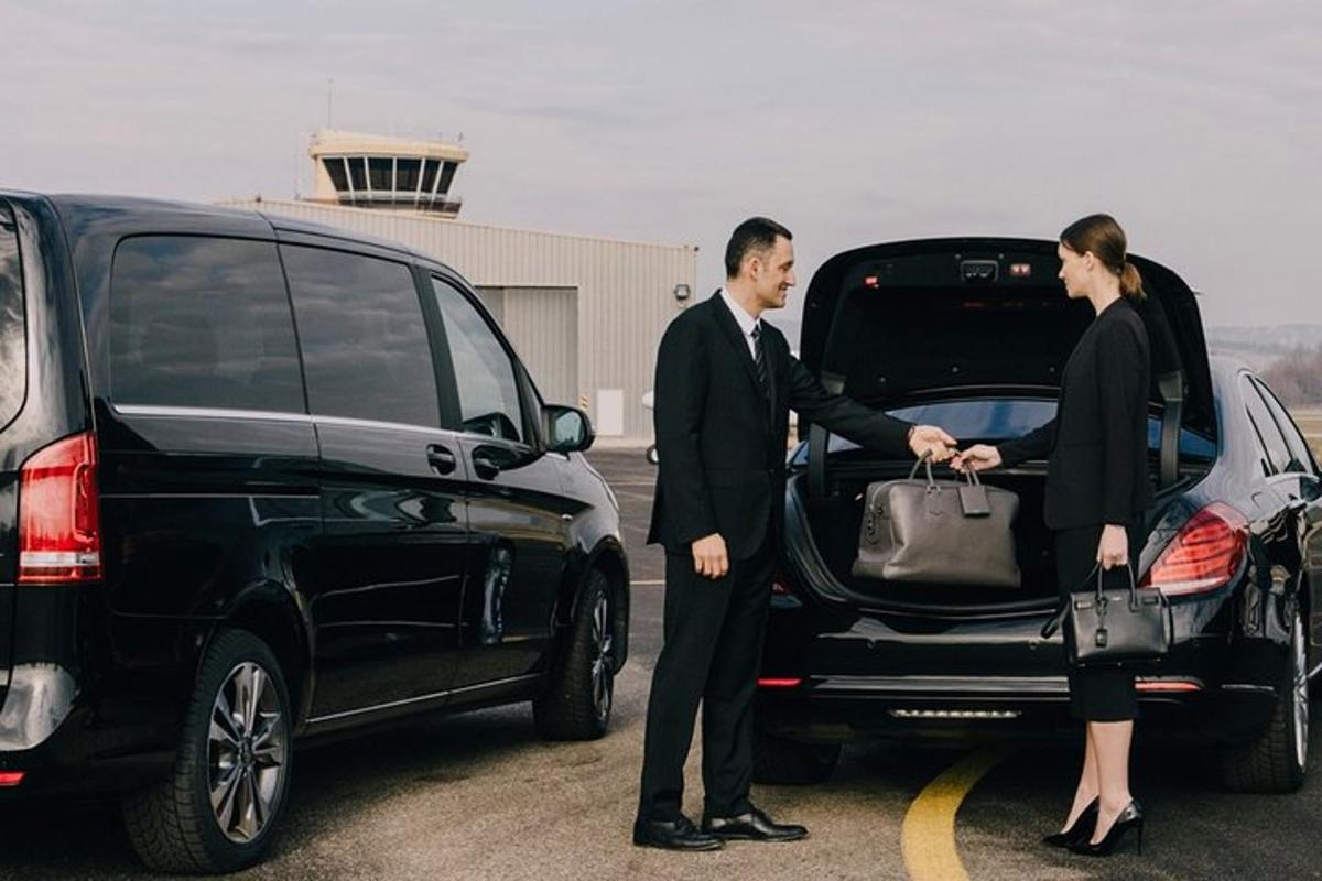 a man and a woman getting into a car
