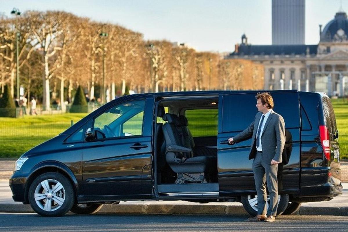 a man standing next to a van with its door open