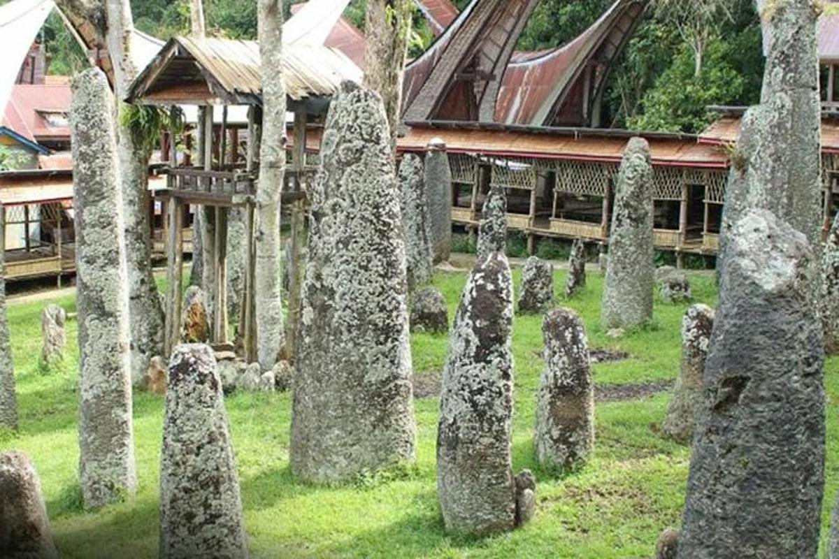 a bunch of stone statues in front of a building
