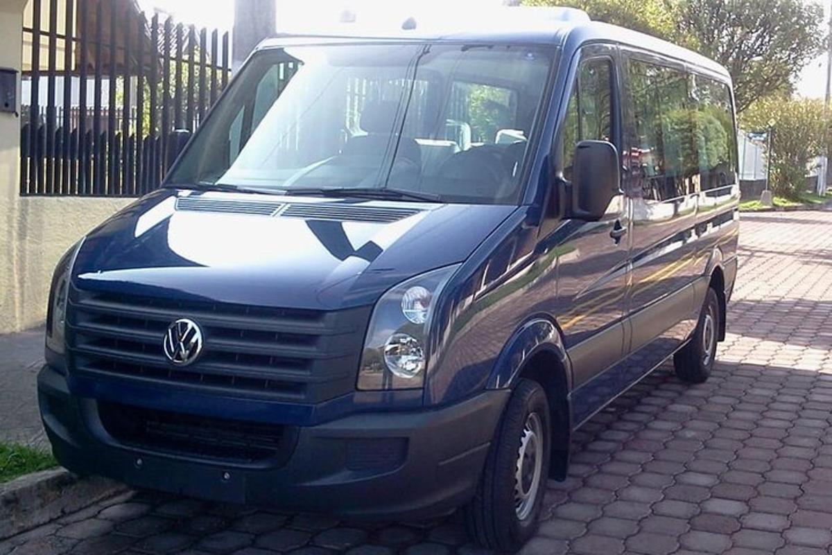 a blue van is parked on a street