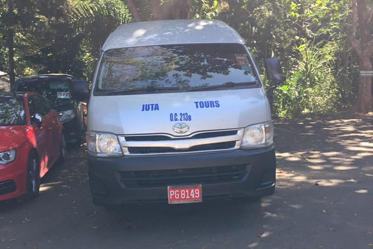 a white van is parked in a parking lot
