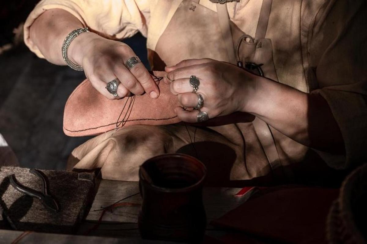 a woman is cutting a persons foot with scissors
