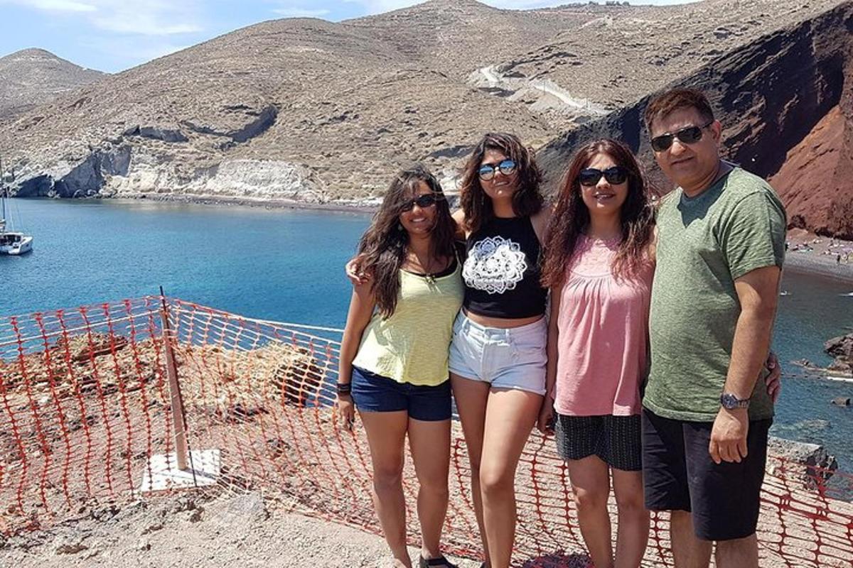 a group of people standing next to a body of water