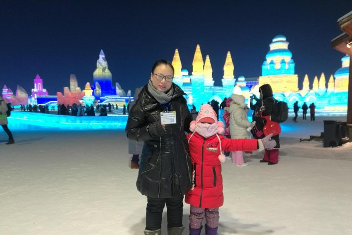 a man and a child standing in front of an ice castle