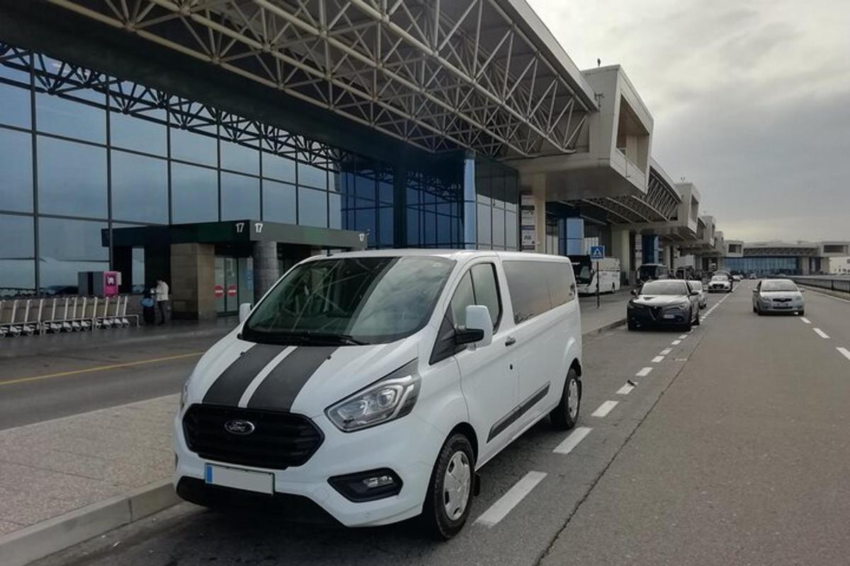 a white van parked on the side of a road