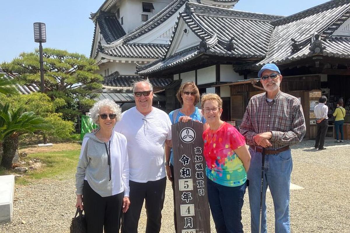 a group of people standing in front of a building