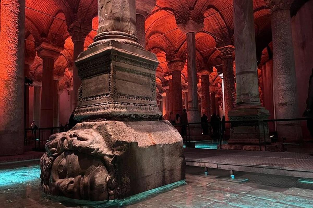 a stone pillar in a building with red lights