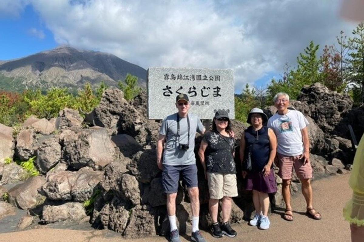 a group of people standing in front of a sign