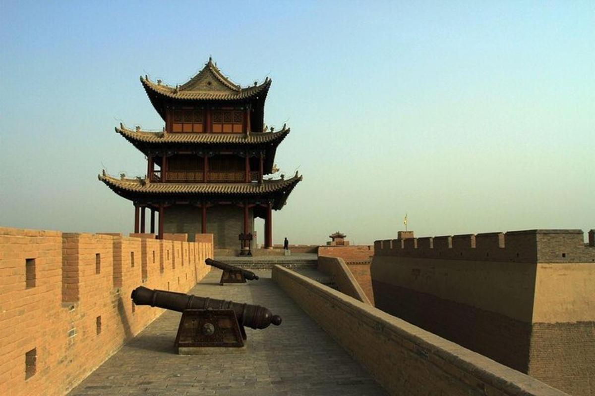 a building with a cannon on top of a wall