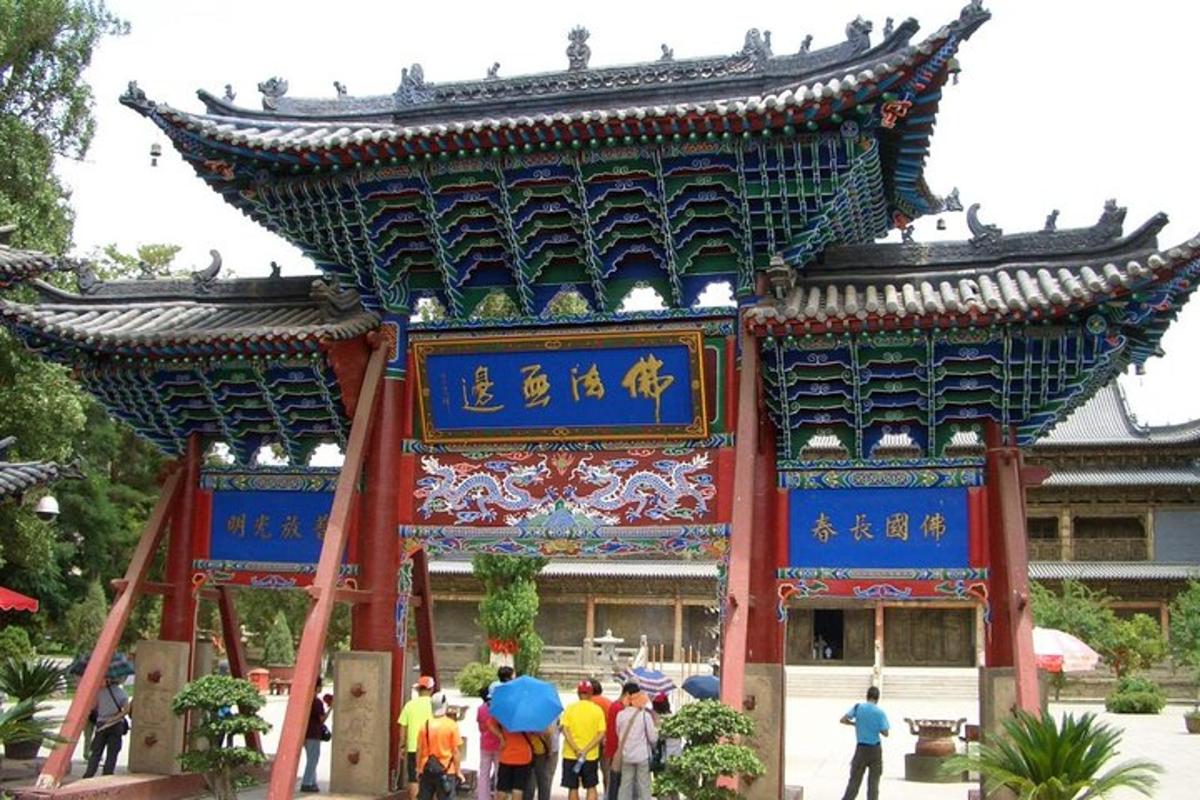 a large building with people standing in front of it