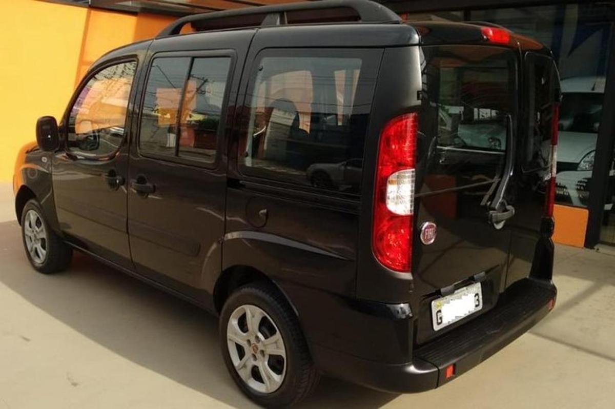 a black van is parked in a garage