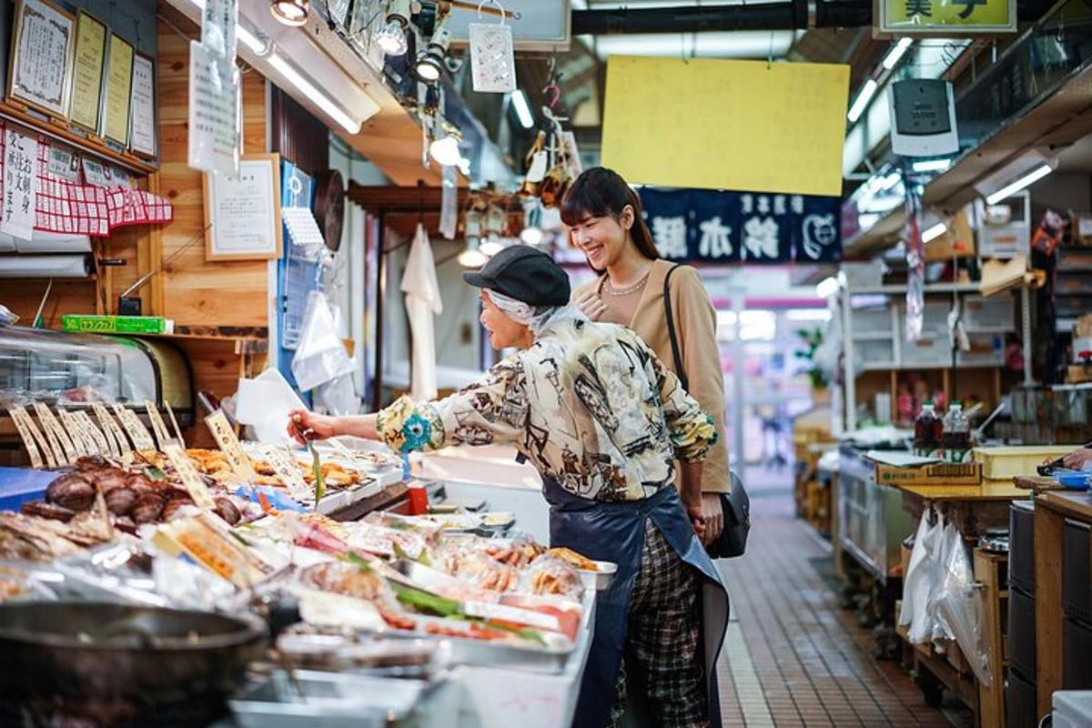 a woman helping a woman preparing food in a market