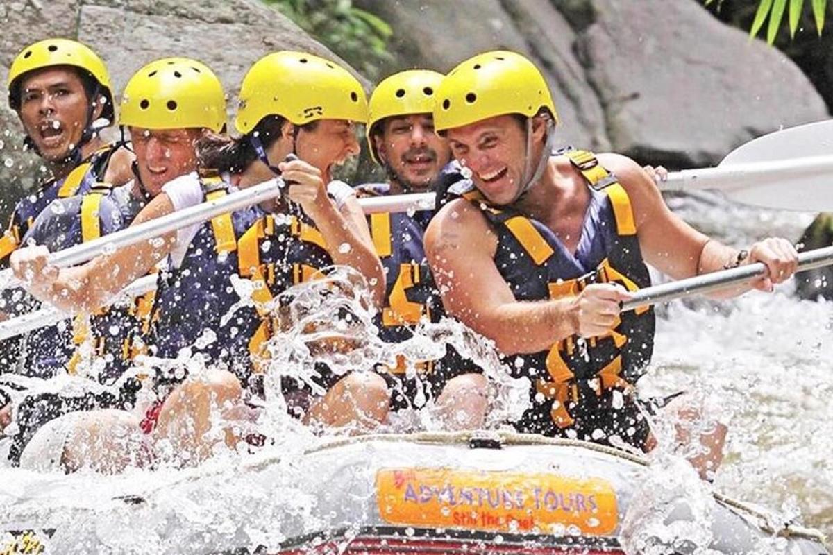 a group of people in a raft on a river