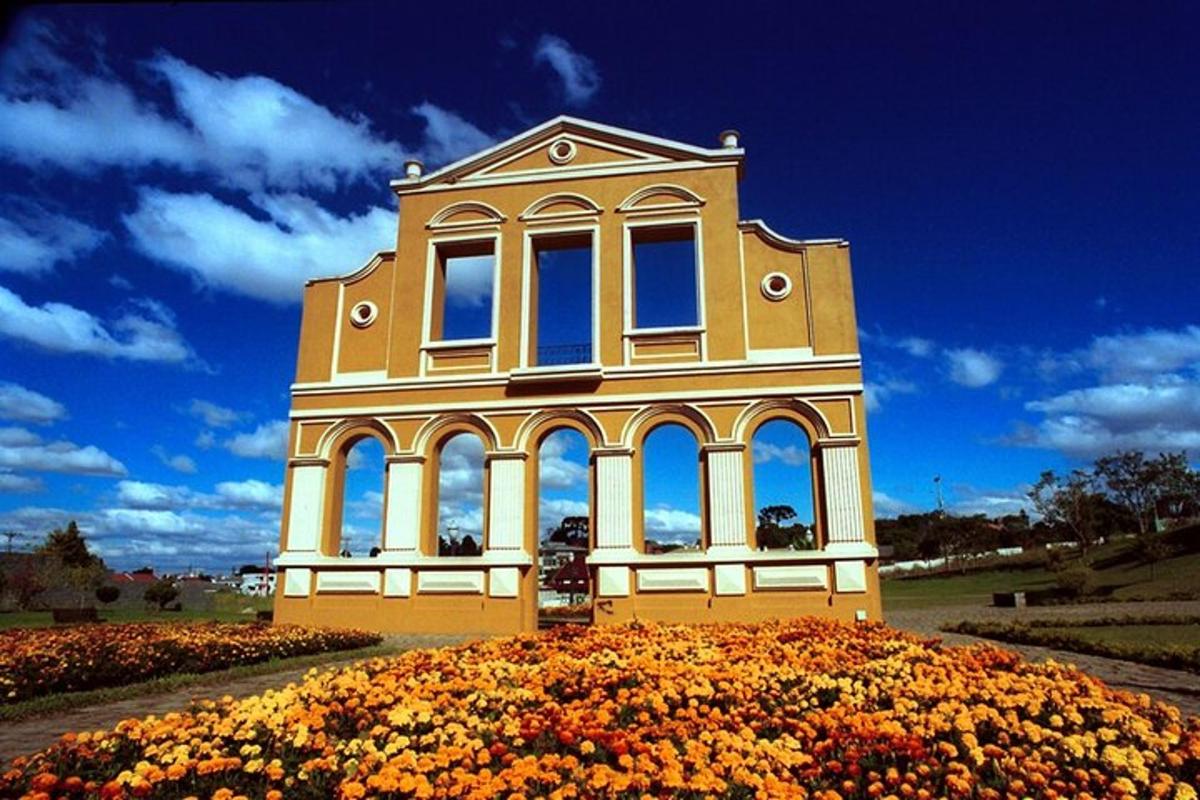 a building sitting on top of a field of flowers