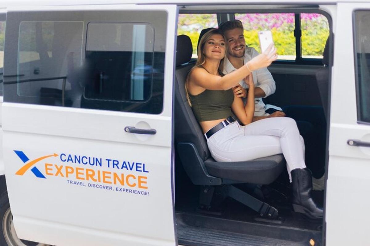 a man and a woman sitting in the back of a van