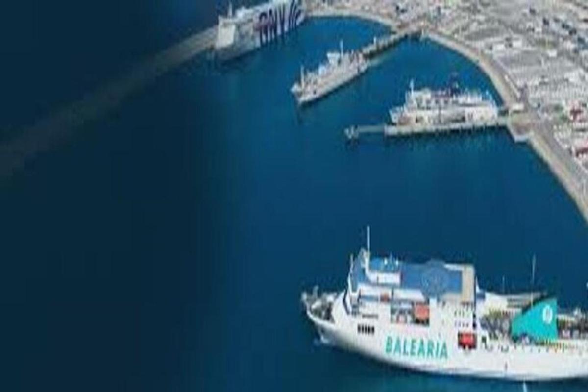 a large boat in the water next to a harbor