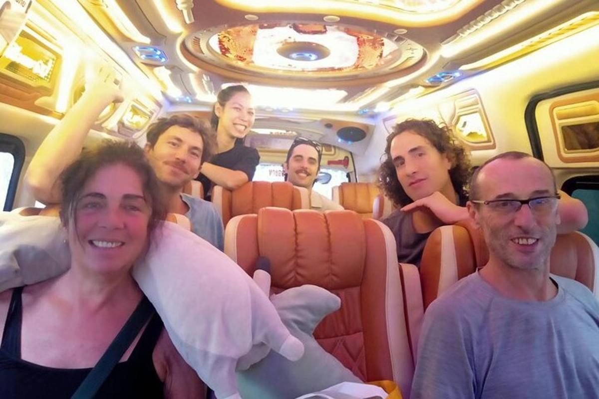a group of people sitting in a bus