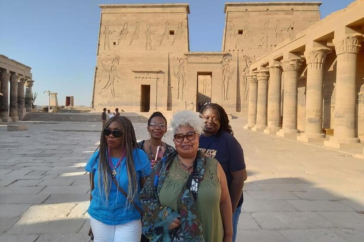a group of women standing in front of a building