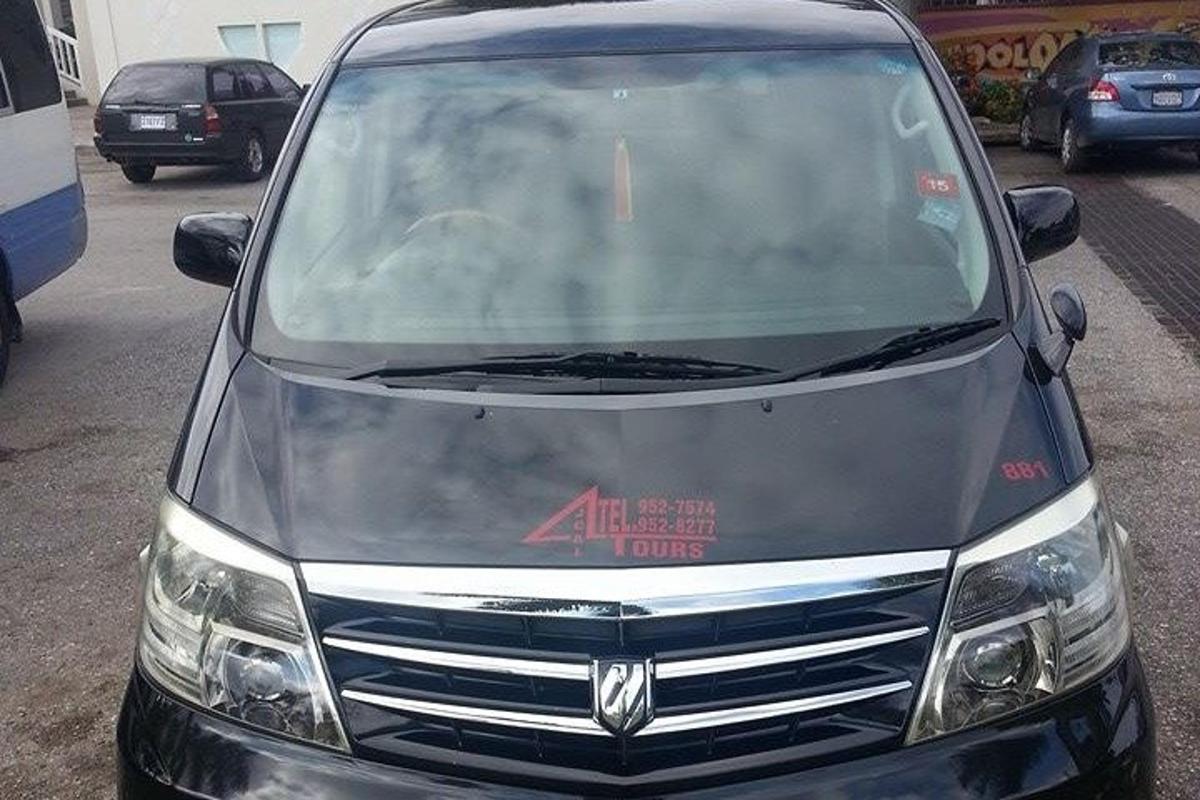 a silver van parked in a parking lot