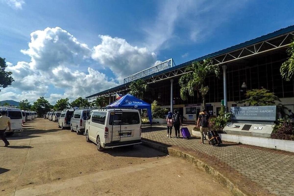 a group of vans parked in front of a building