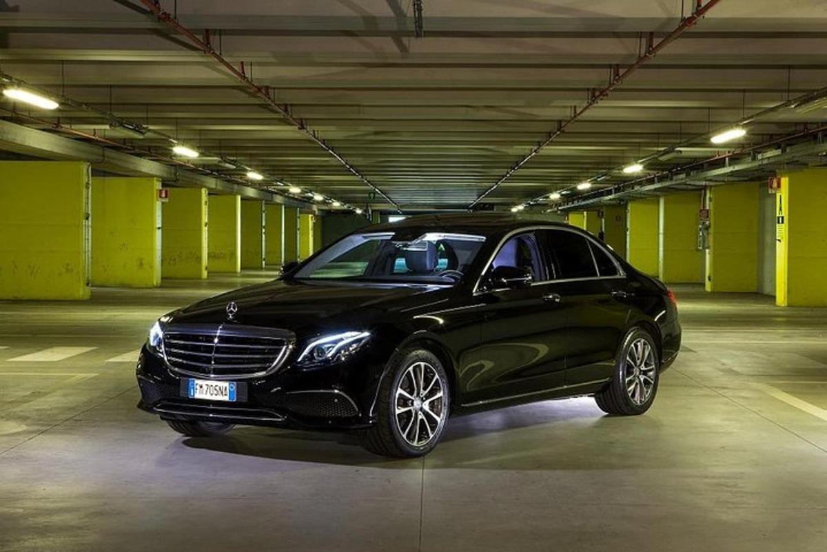 a black car parked in a parking garage