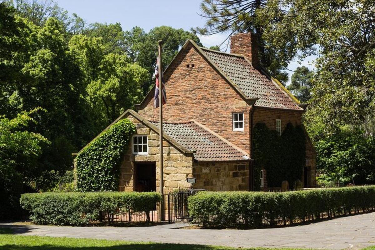 a brick house with a flag in front of it